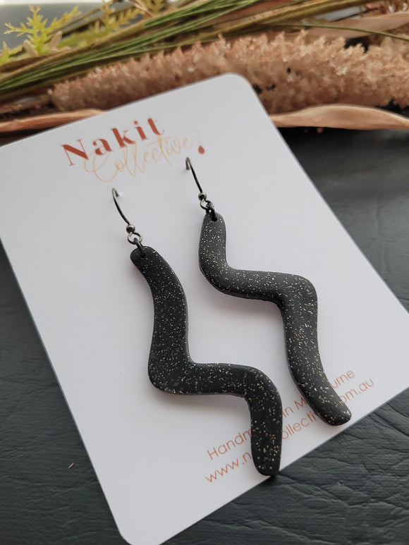 Black and silver glitter squiggle dangle earrings